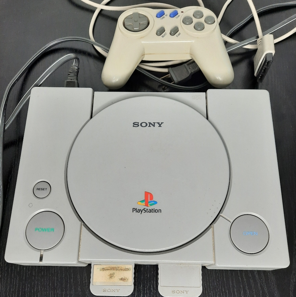 Playstation 1 Console with 2 memory cards and a controller